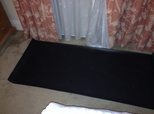 Just about room for my mat between the bed and the window!
