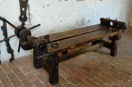 torture-device-resting-on-brick-ground